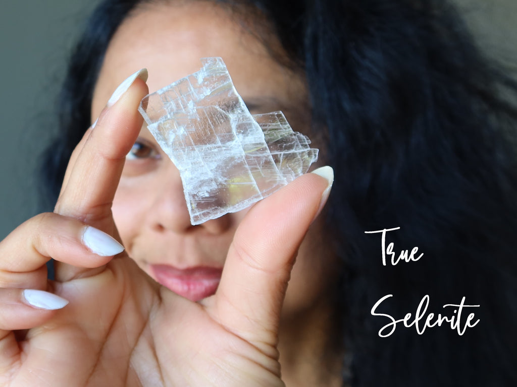 woman looking through true selenite plate