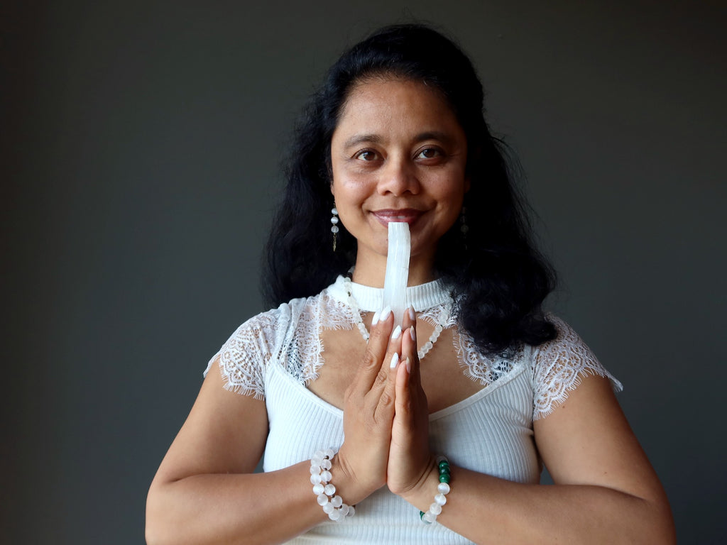 sheila of satin crystals holding raw selenite stick