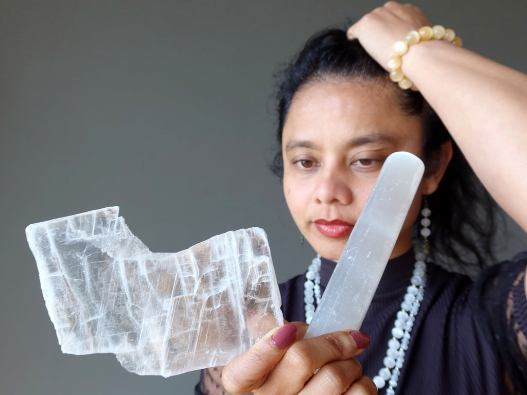 sheila of satin crystals looking at true selenite and satin spar massage wand