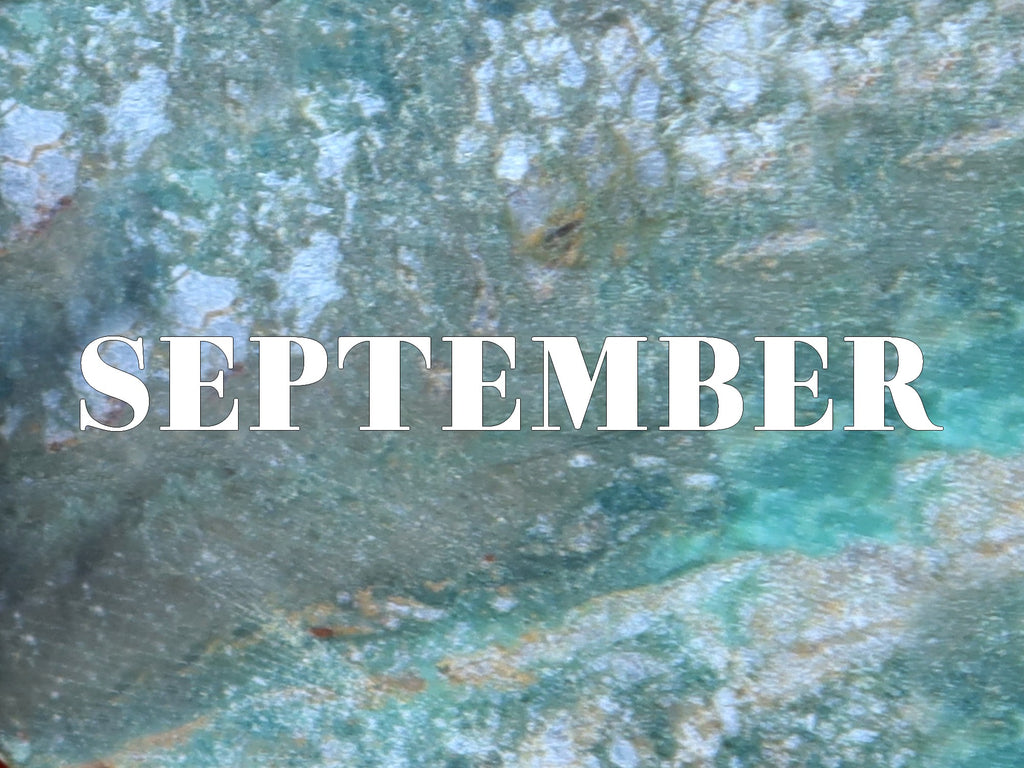 word september on turquoise background