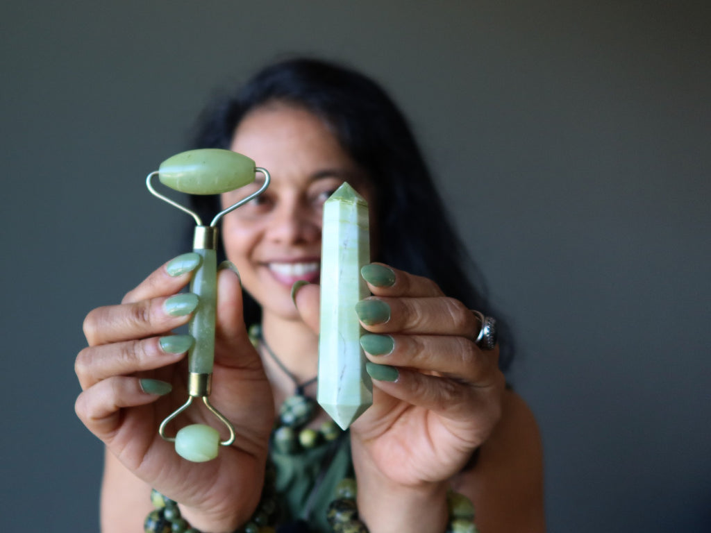 woman holding serpentine wands