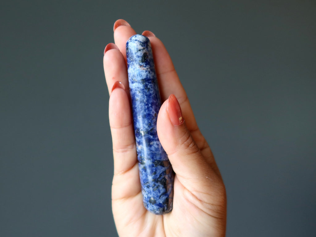 hand holding sodalite massage wand