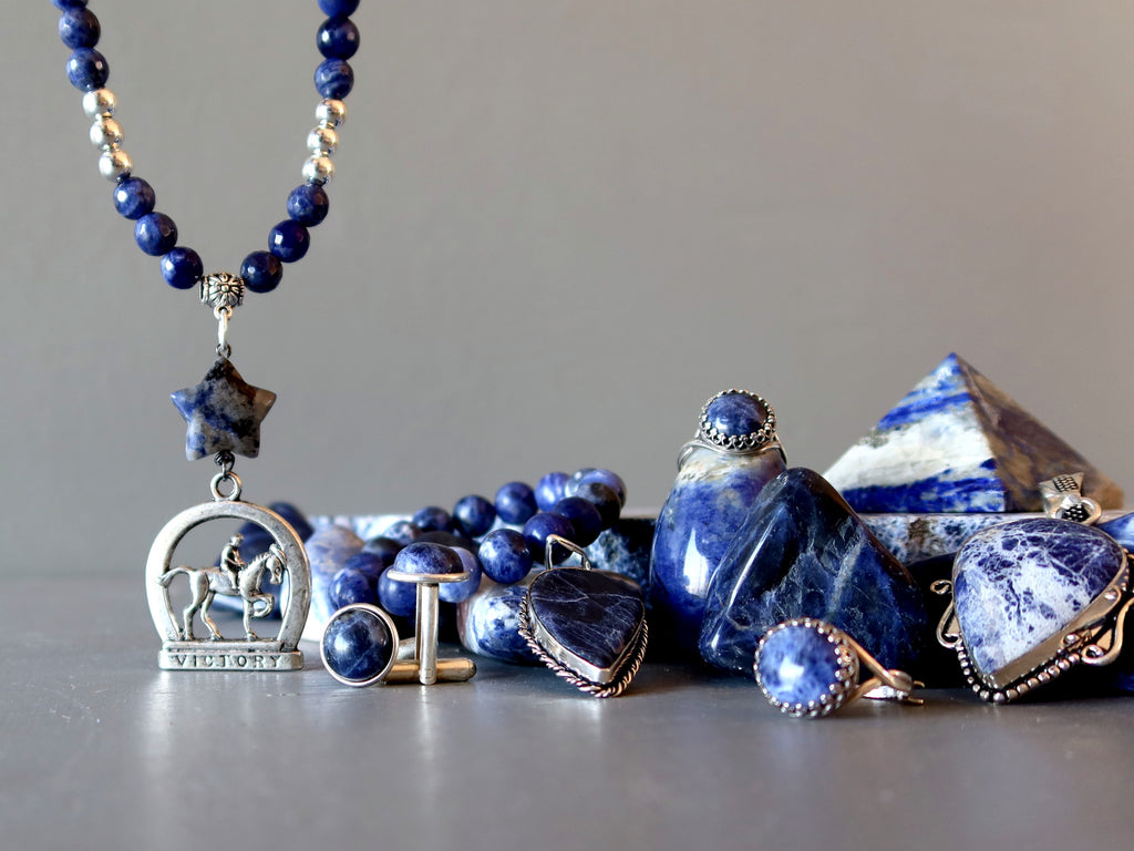 pile of blue and white sodalite jewelry