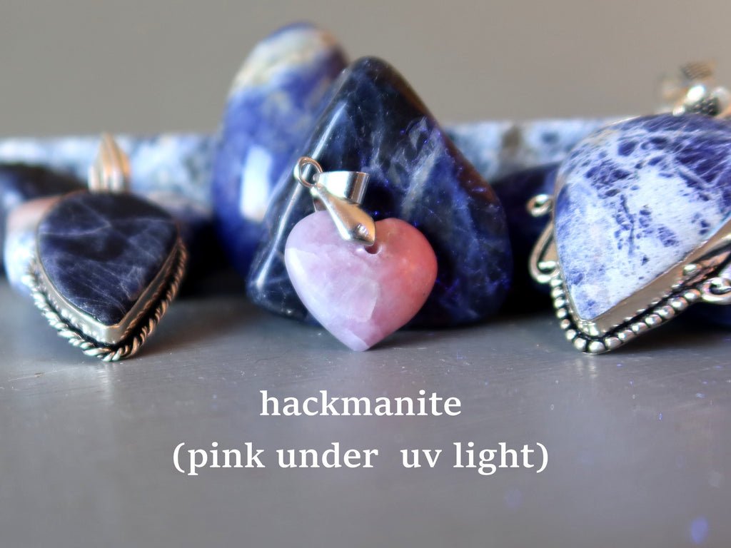 hackmanite heart pendant pink under uv light