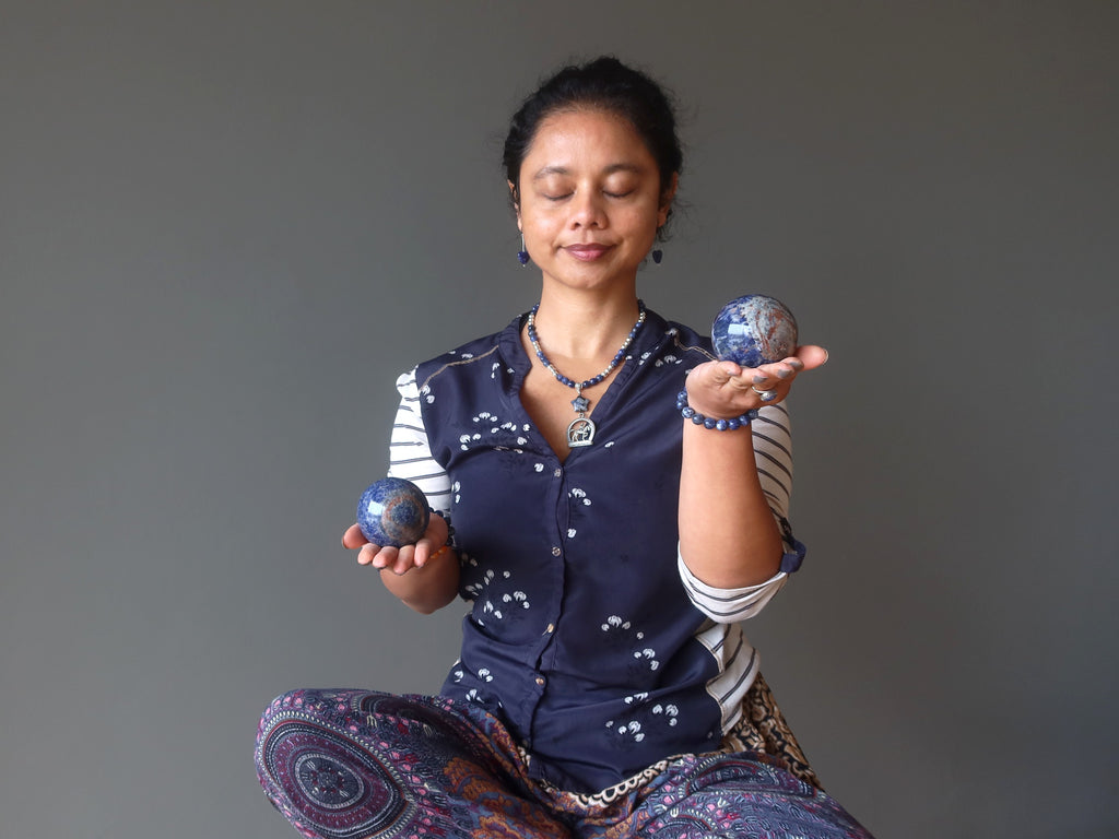 sheila of satin crystals meditating with sodalite spheres