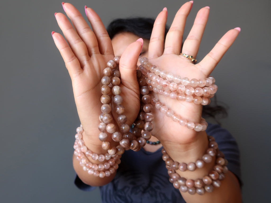 woman wearing sunstone bracelets