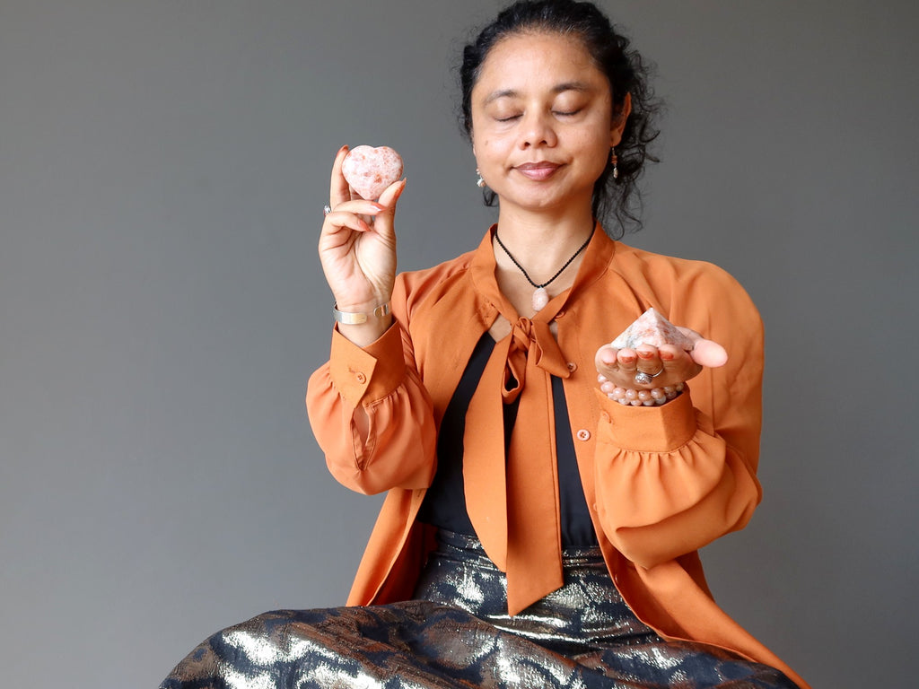 sheila of satin crystals meditating with sunstone heart and pyramid