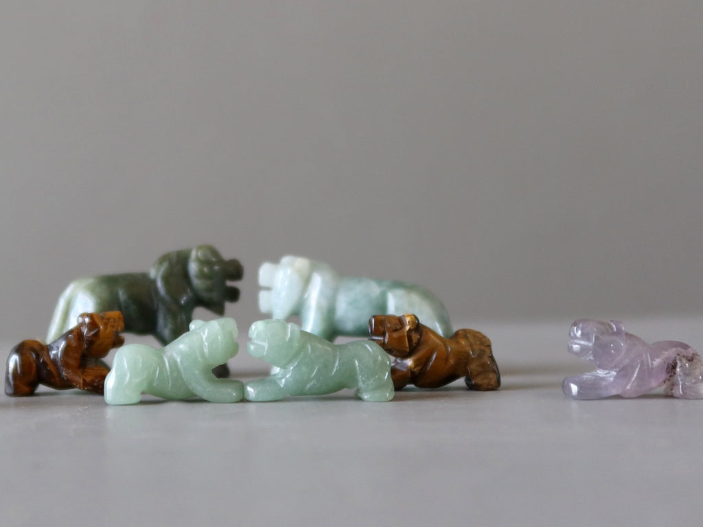 green aventurine, jade, purple amethyst, brown tigers eye tiger figurines