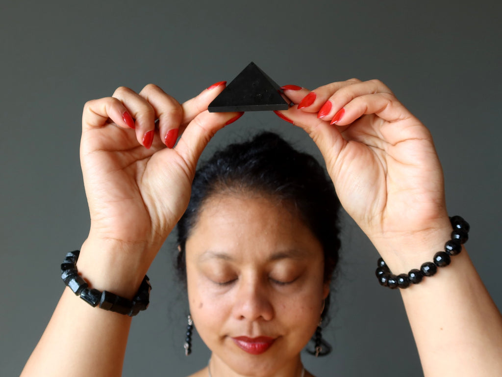 sheila of satin crystals under a black tourmaline pyramid