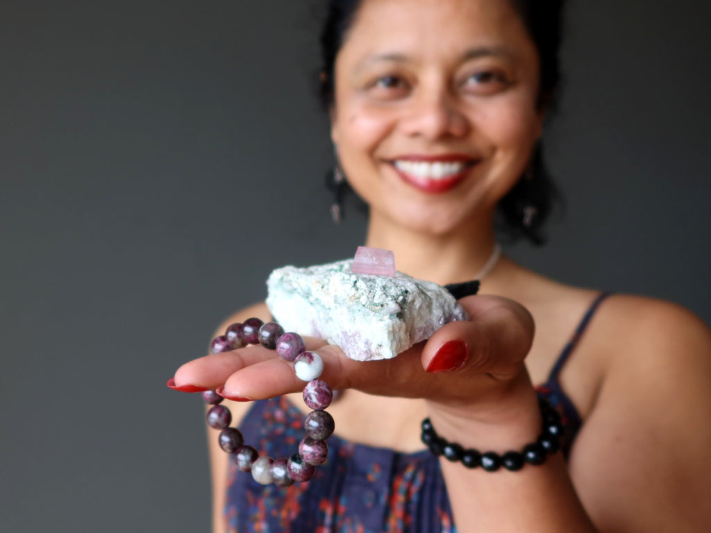 sheila of satin crystals holding tourmaline crystals