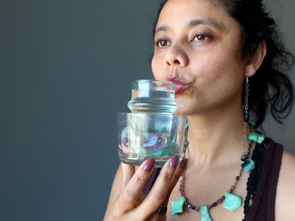 woman drinking a gem elixir