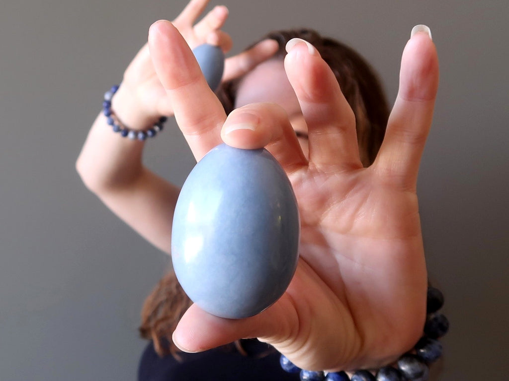 female holding angelite egg