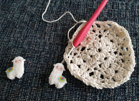 Snowy Llama stitch stoppers with crochet hook and project