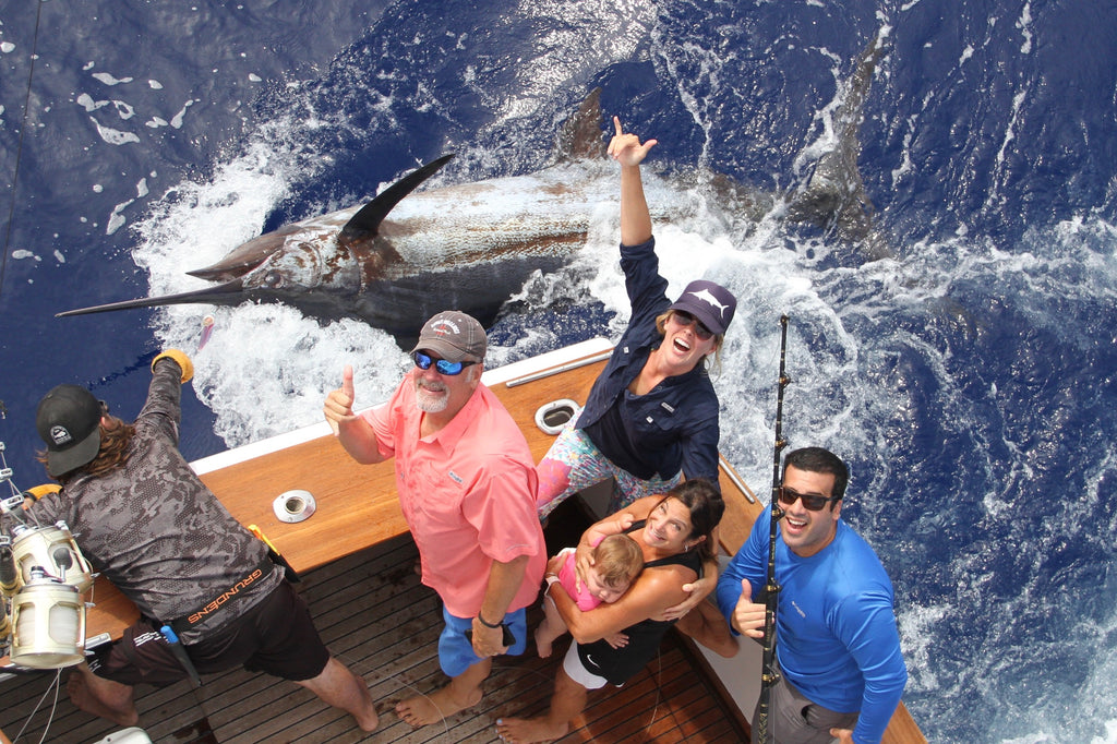 Dana Susina and her famliy with her 550 pound blue marlin tag and release