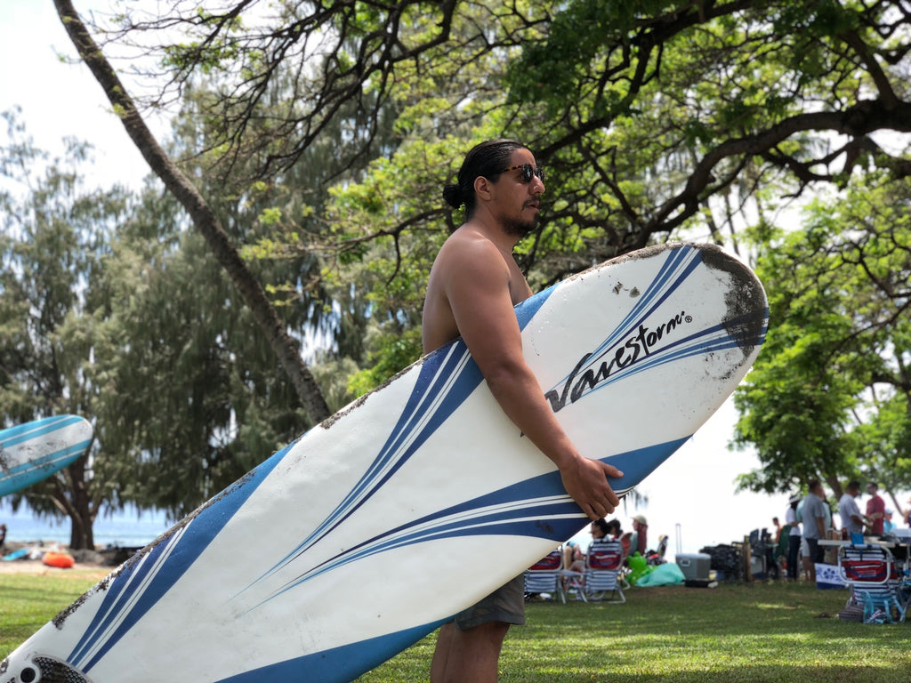 Jon Hans surfing wave storm maui