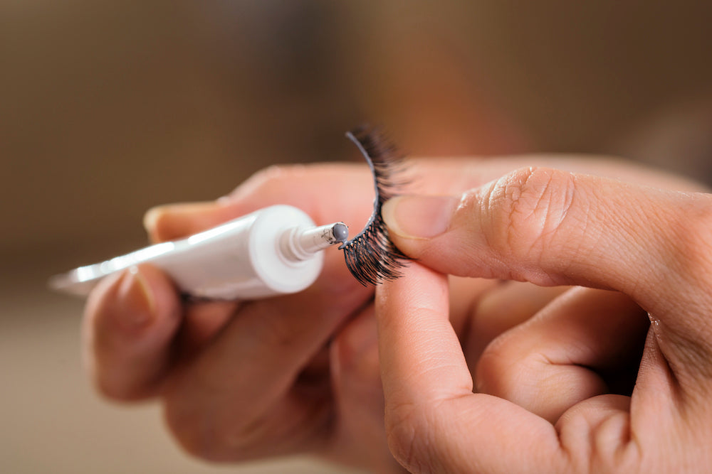 applying false lashes with lash glue
