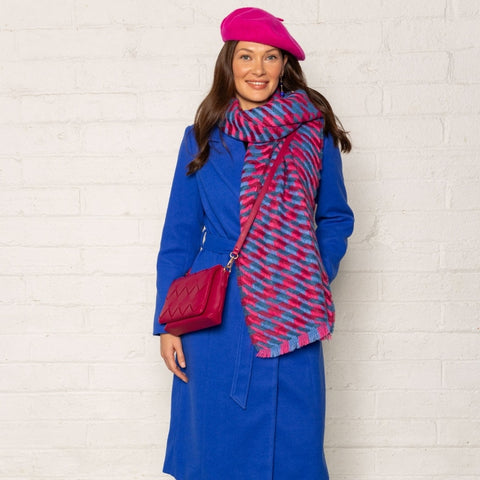 Blue coat with pink accessories