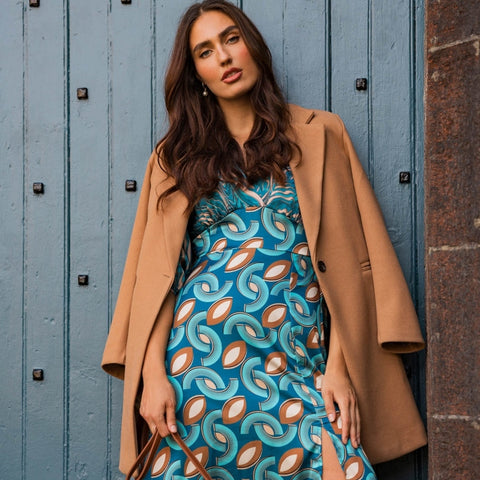 Tan winter coat with teal dress