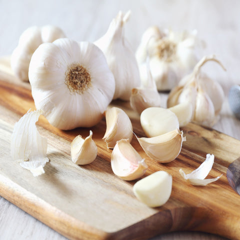 Garlic cloves on a wooden table