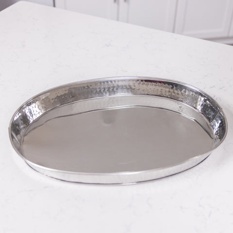 Serving tray hammered in stainless steel for bar or kitchen to use at a party for snacks, drinks, or mixing cocktails.