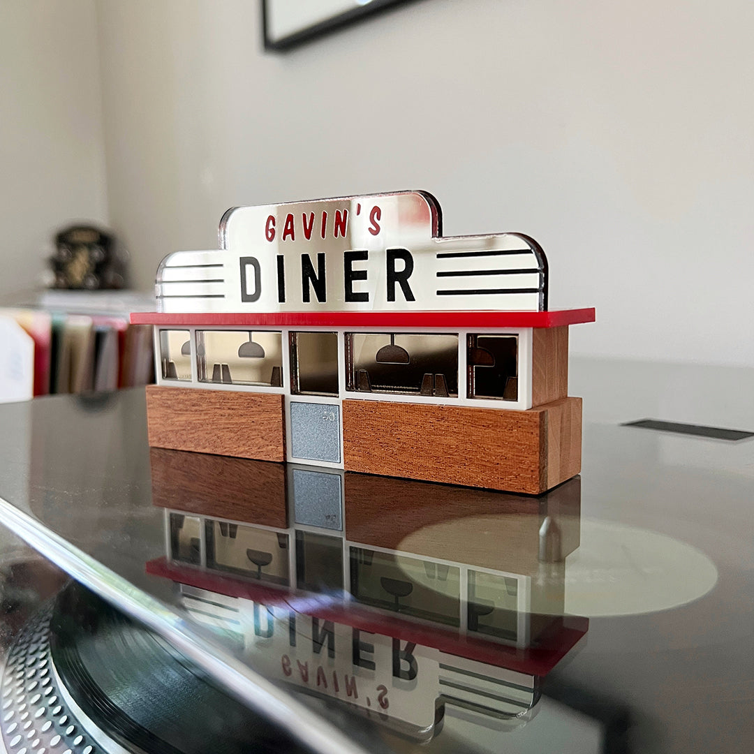 A miniature American diner ornament made from wood and acrylic