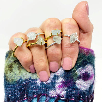 Aquamarine Gemstone Rings in Gold and Silver on a womans hand