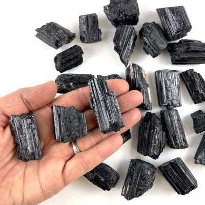 Black Tourmaline in hand for size reference