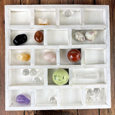 A white crystal Collector Display Organizer to fit 18 beautiful small crystals and stones