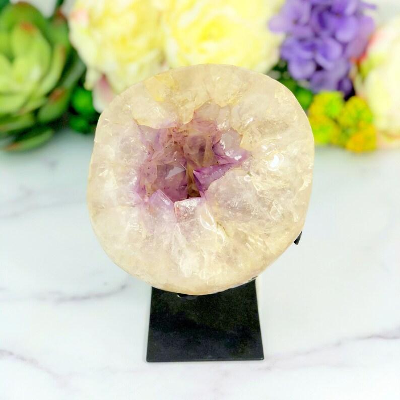 Picture of the front side of the geode on metal stand.
