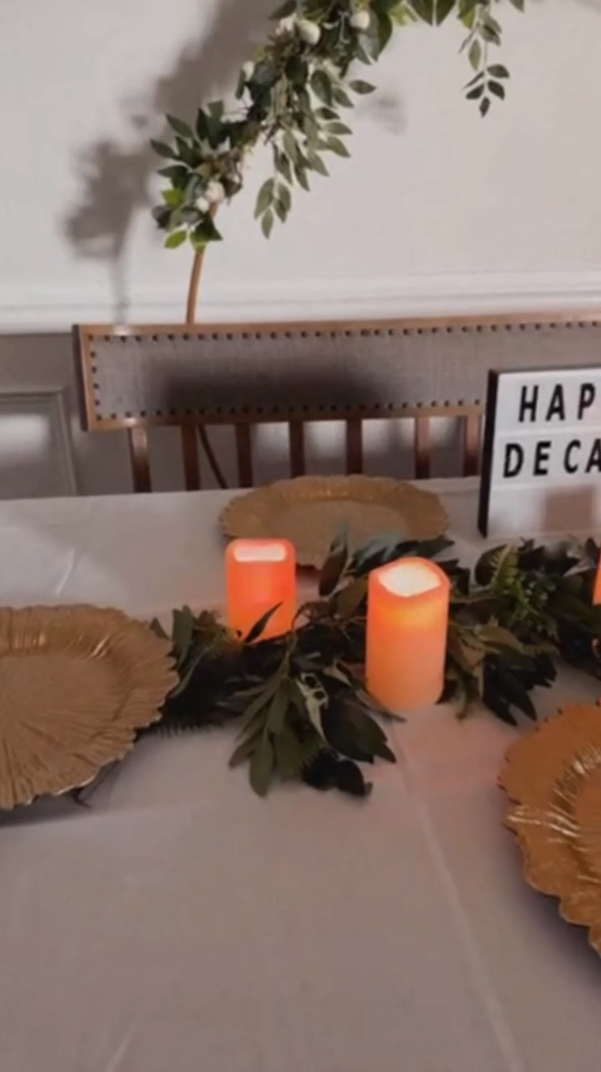 Table setting with table linens, charger plates, and LED candles