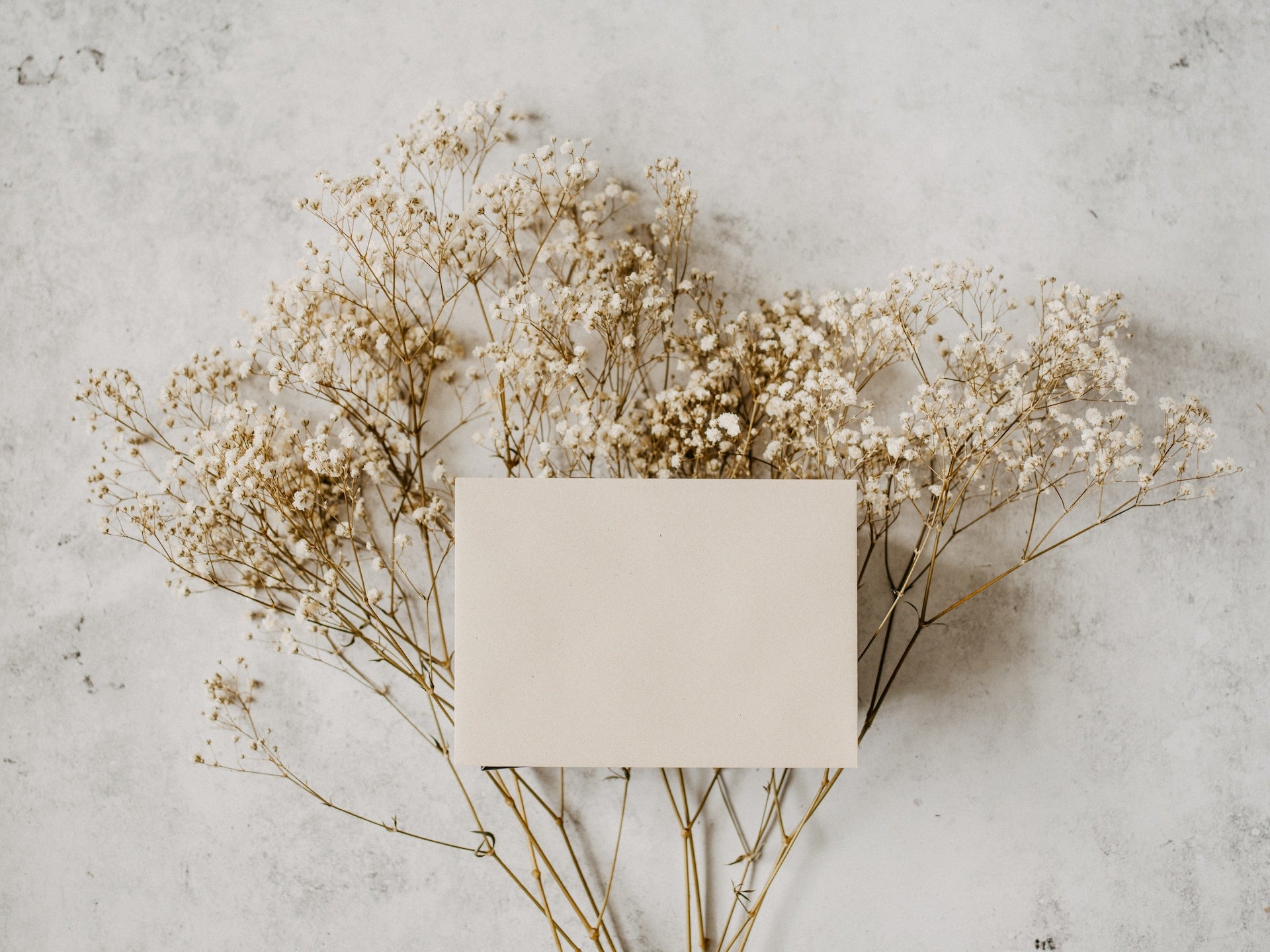 Card on top of baby's breath flowers