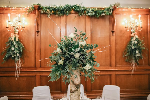 Hanging flower centerpieces with candelabras