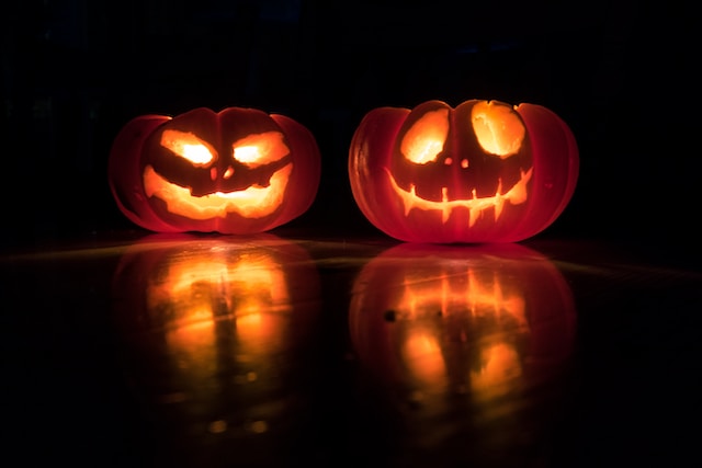 Carved pumpkin lit in the dark