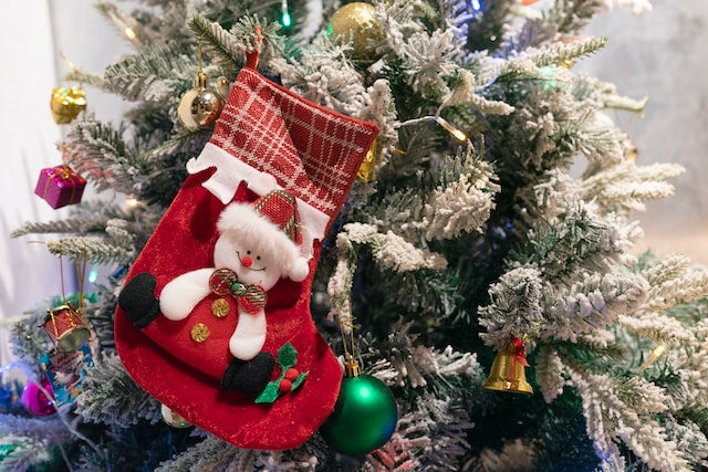 Christmas sock decorations hanging on a tree