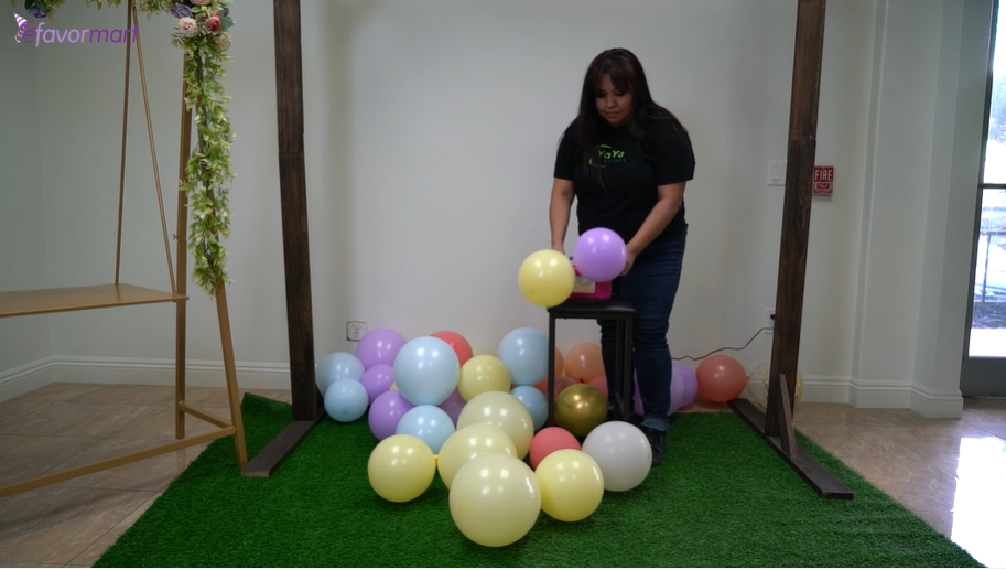 Woman inflating party balloons