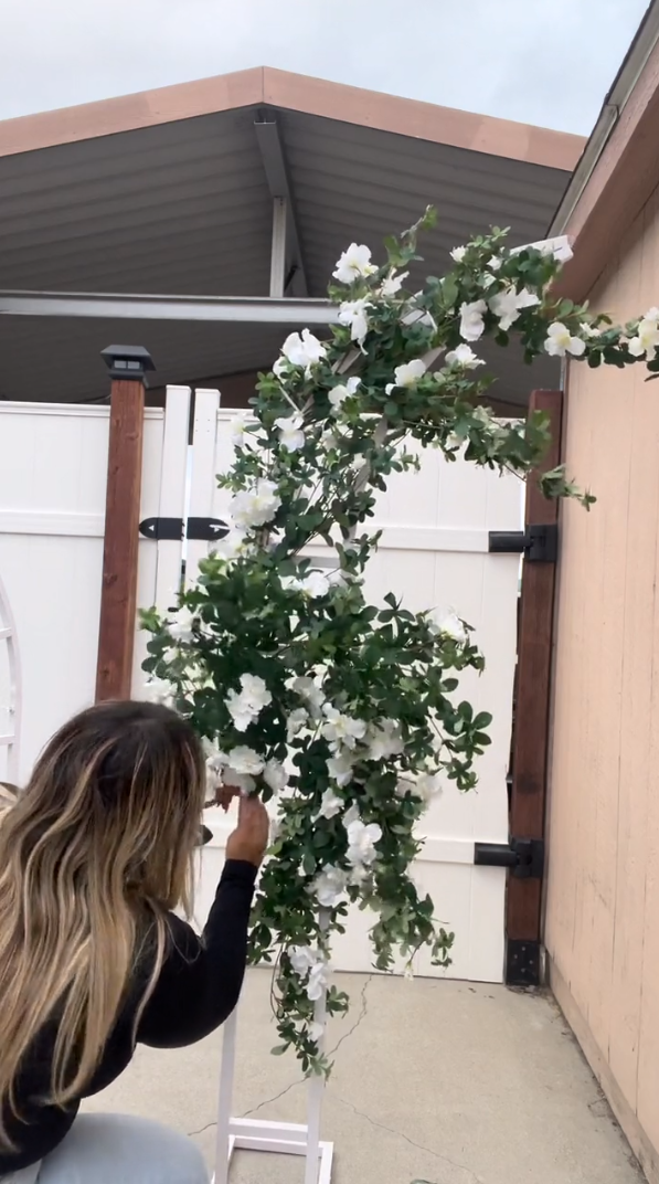 Installing artificial flowers to the arch frame