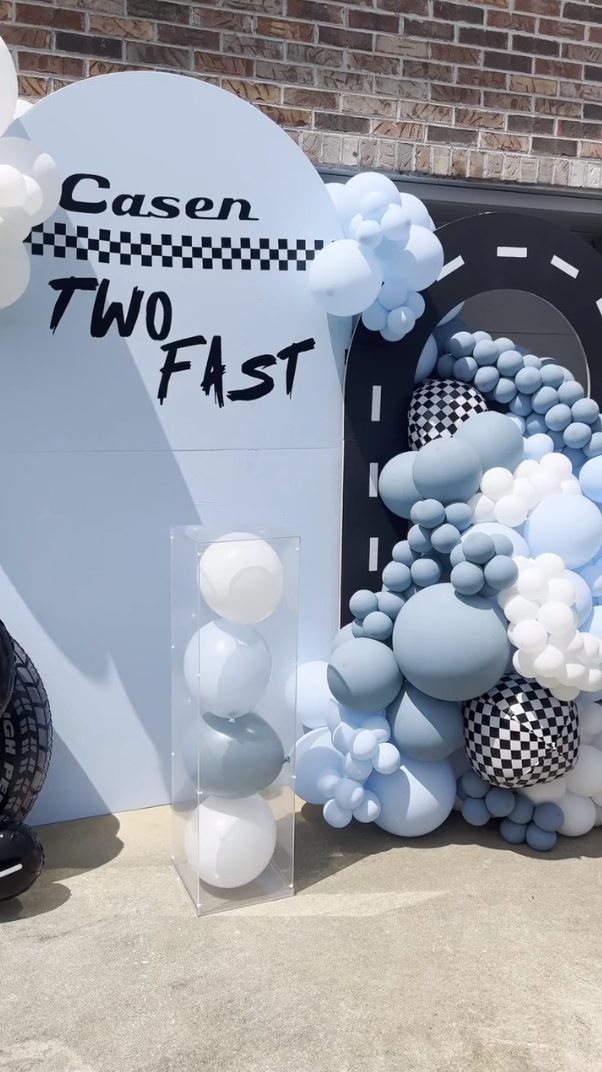 Two Fast birthday theme backdrop with balloons and acrylic stands