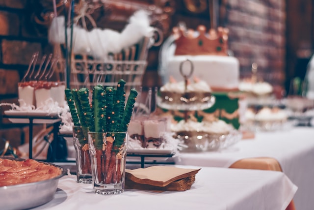 Rehearsal dinner buffet using serving trays, cake stands, and dish bowls