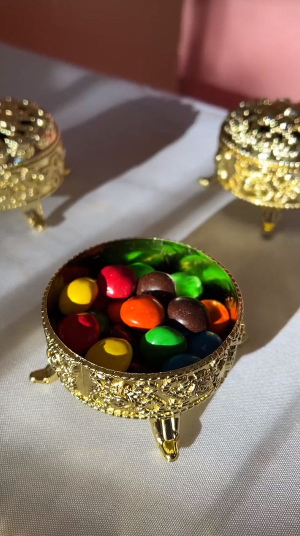 Gold candy containers filled with candy