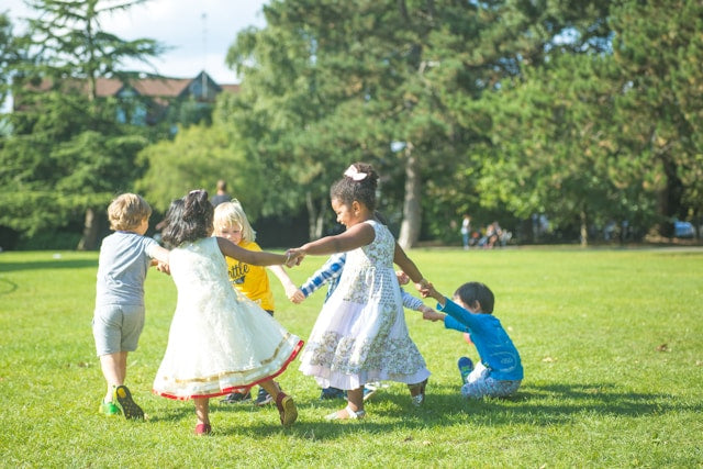 Greenery backdrop with children playing