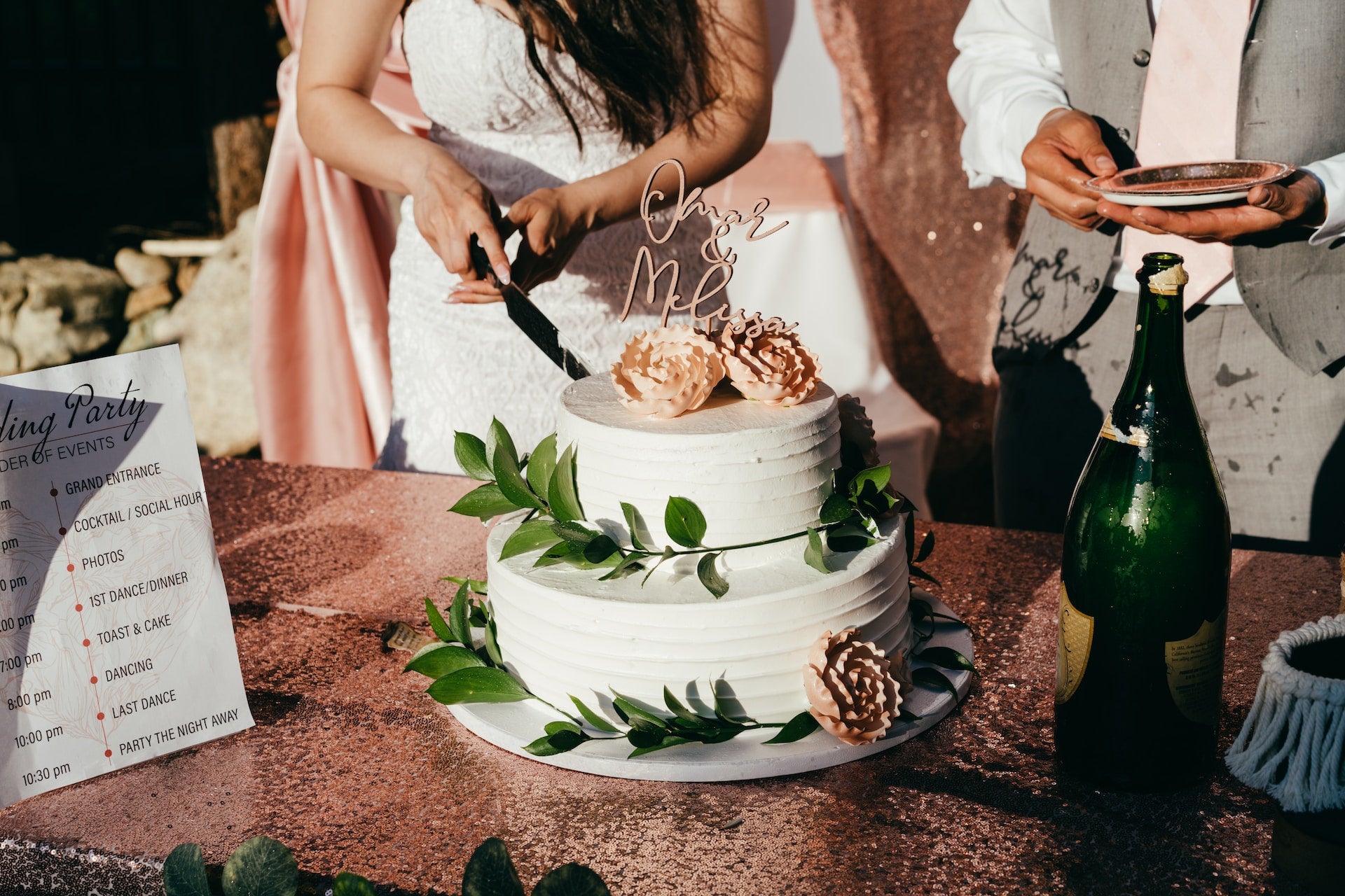 Bride and groom slicing a wedding cake