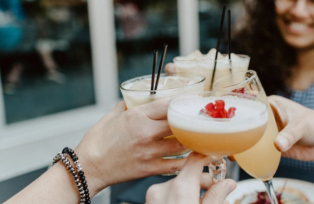 Cocktail glasses in a toast