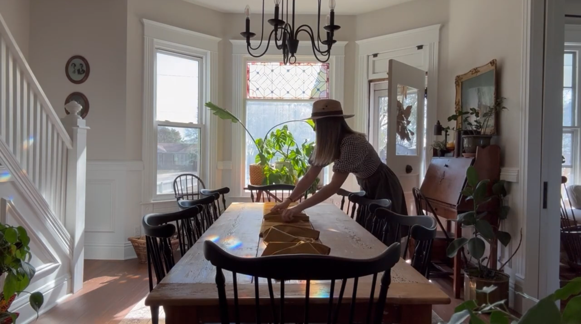 Person laying out a gold table runner