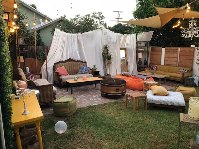 Outdoor party with drapes, curtains, and string lights