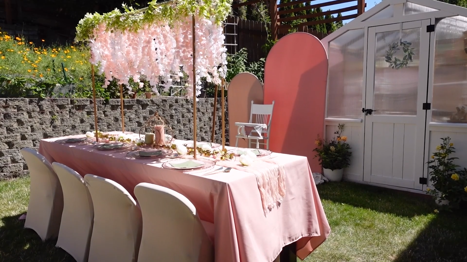 Table setting with floral installations, disposable dinnerware, and centerpieces