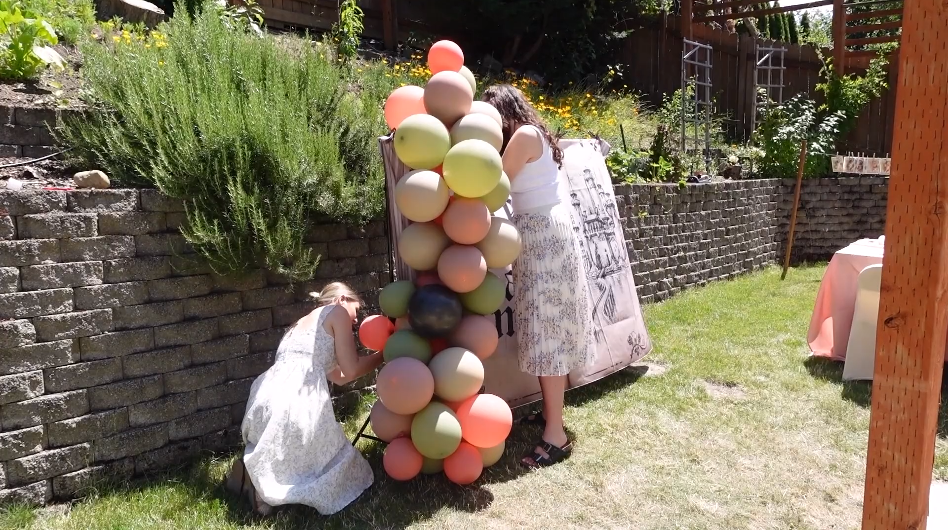 People assembling a balloon garland