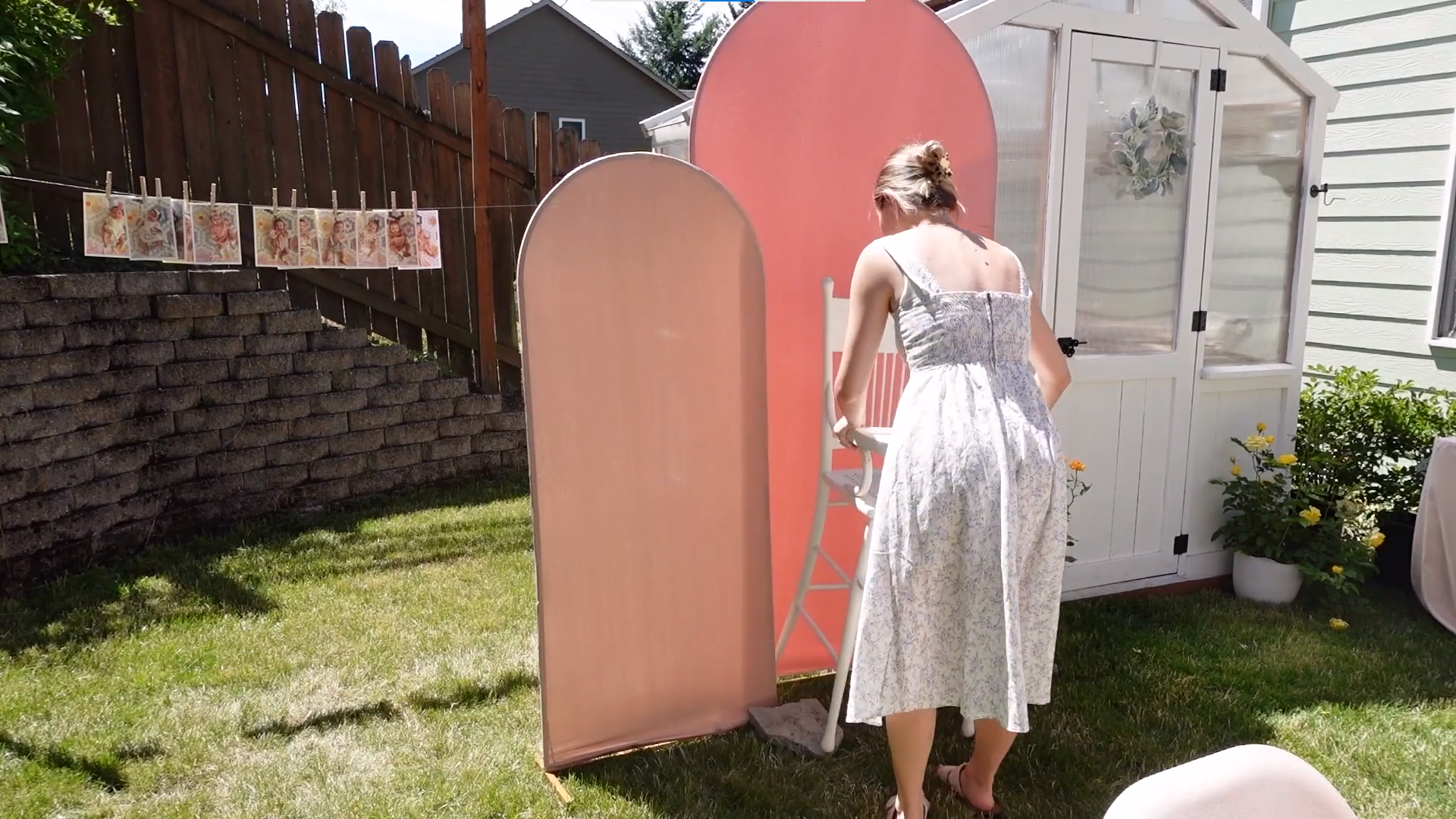 Woman arranging the backdrop stand with fitted covers