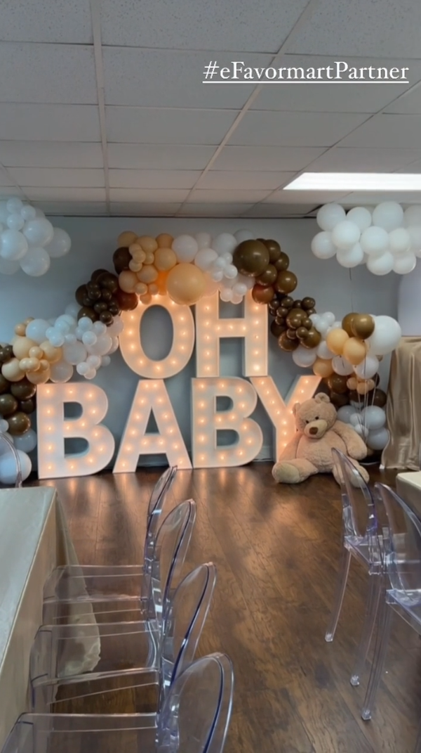 Lit up marquee letters with balloon garland decor