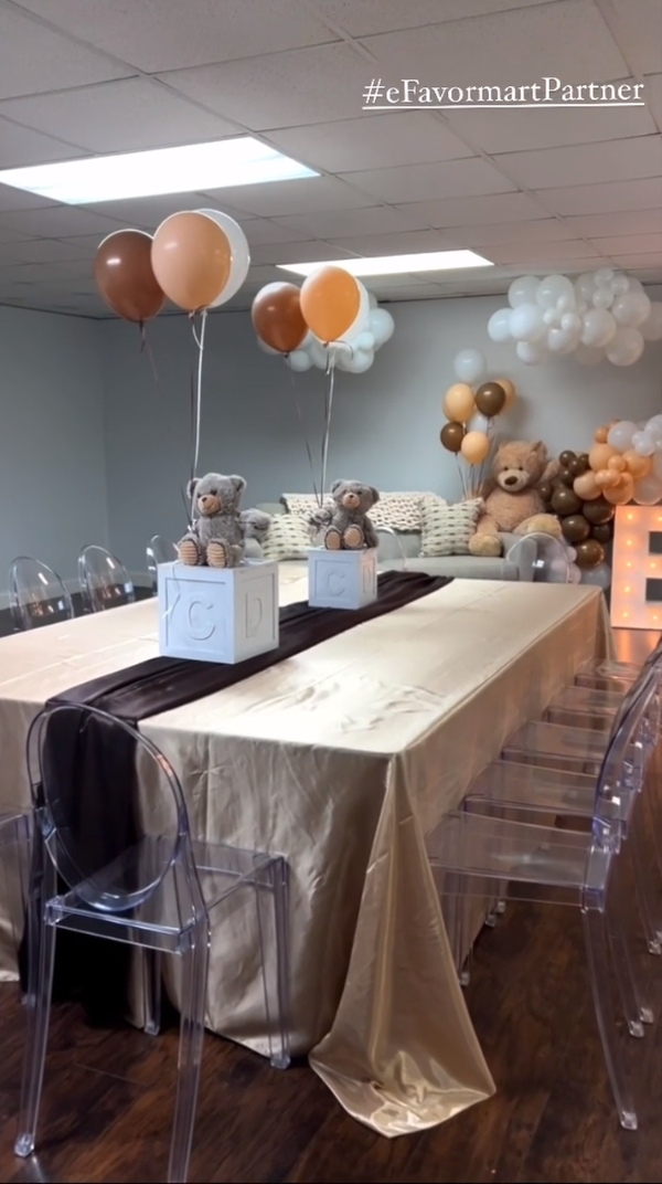 Table setting with tablecloth, runner, teddy bears, and balloons