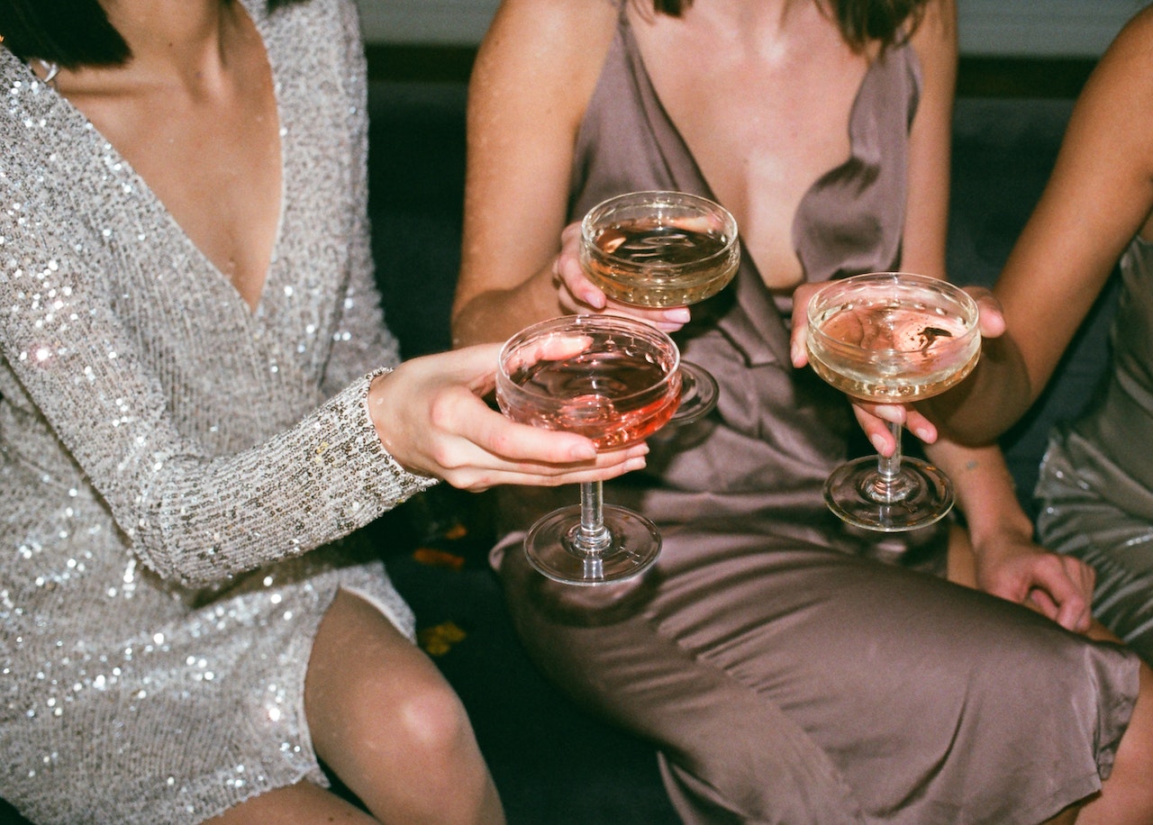 Ladies holding cocktail glasses